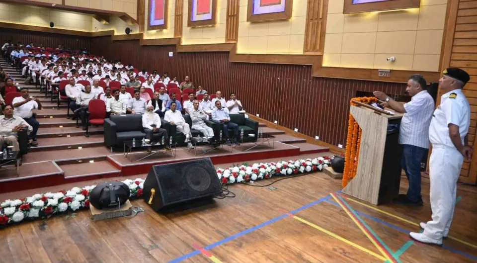 On the dais at a review meeting